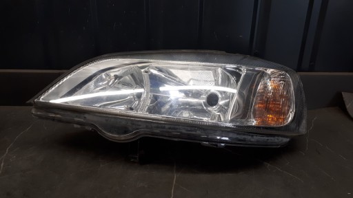 90520877 LEWY FAVER OPEL ASTRA II G HELLA